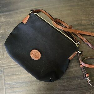 Dooney & Bourkey Cross Body bag , canvas made with leather adjustable straps